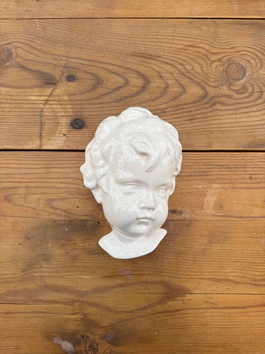 Väggskulptur ansikte