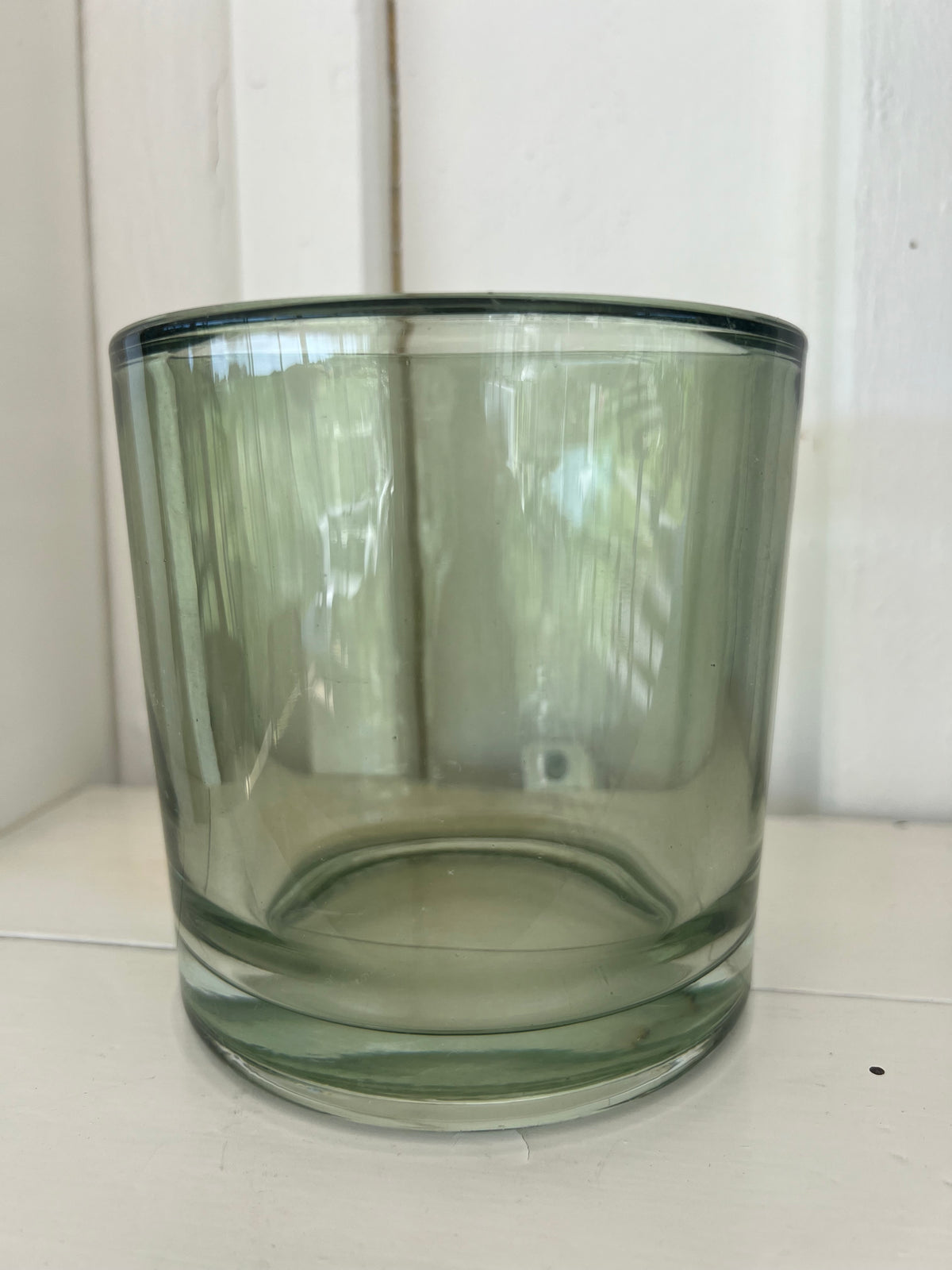 Stor ljuslykta i grönt glas