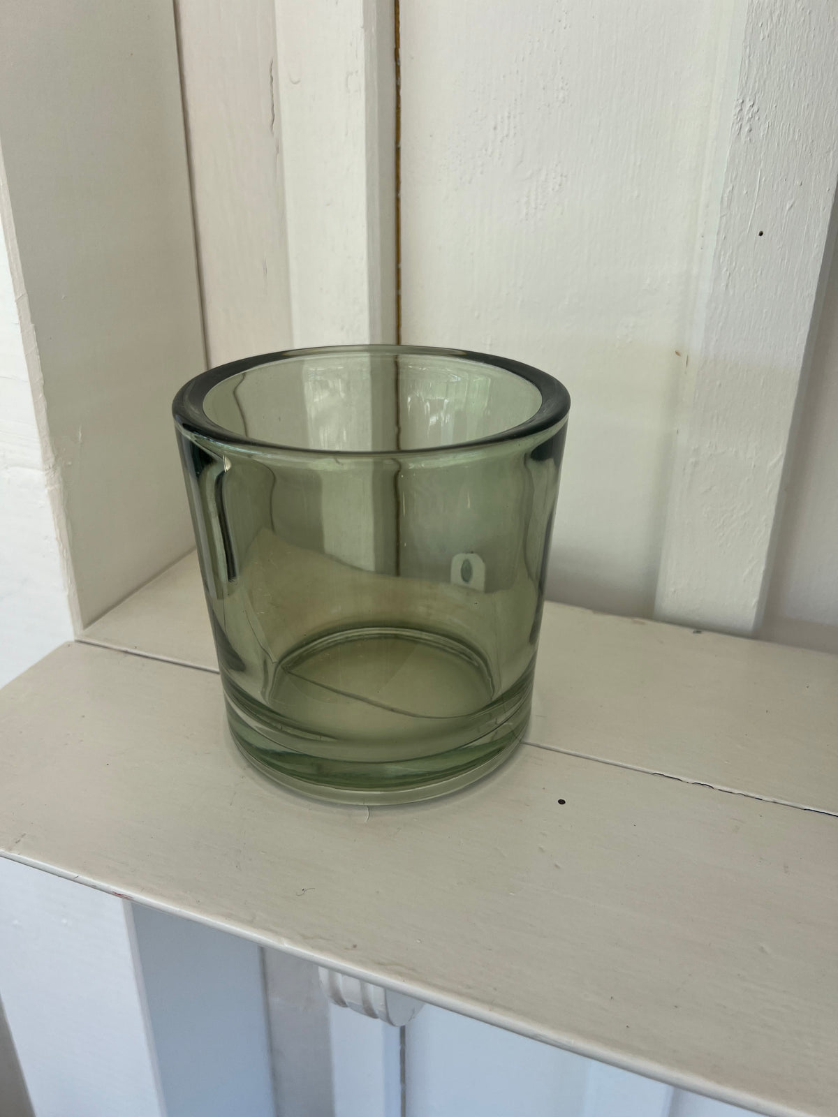 Stor ljuslykta i grönt glas