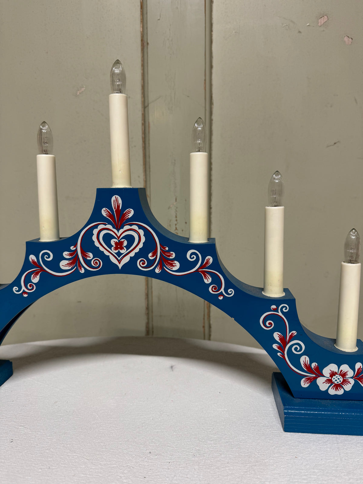 Blå adventsljusstake med målning