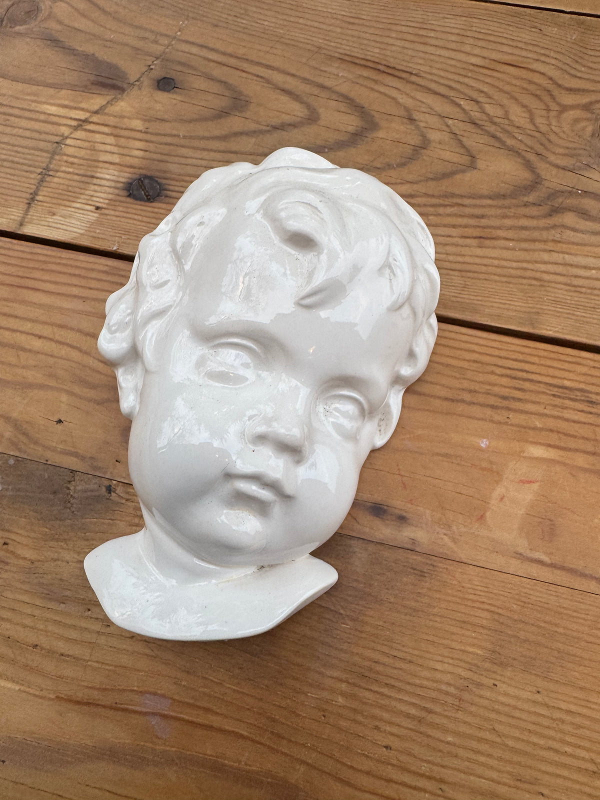 Väggskulptur ansikte