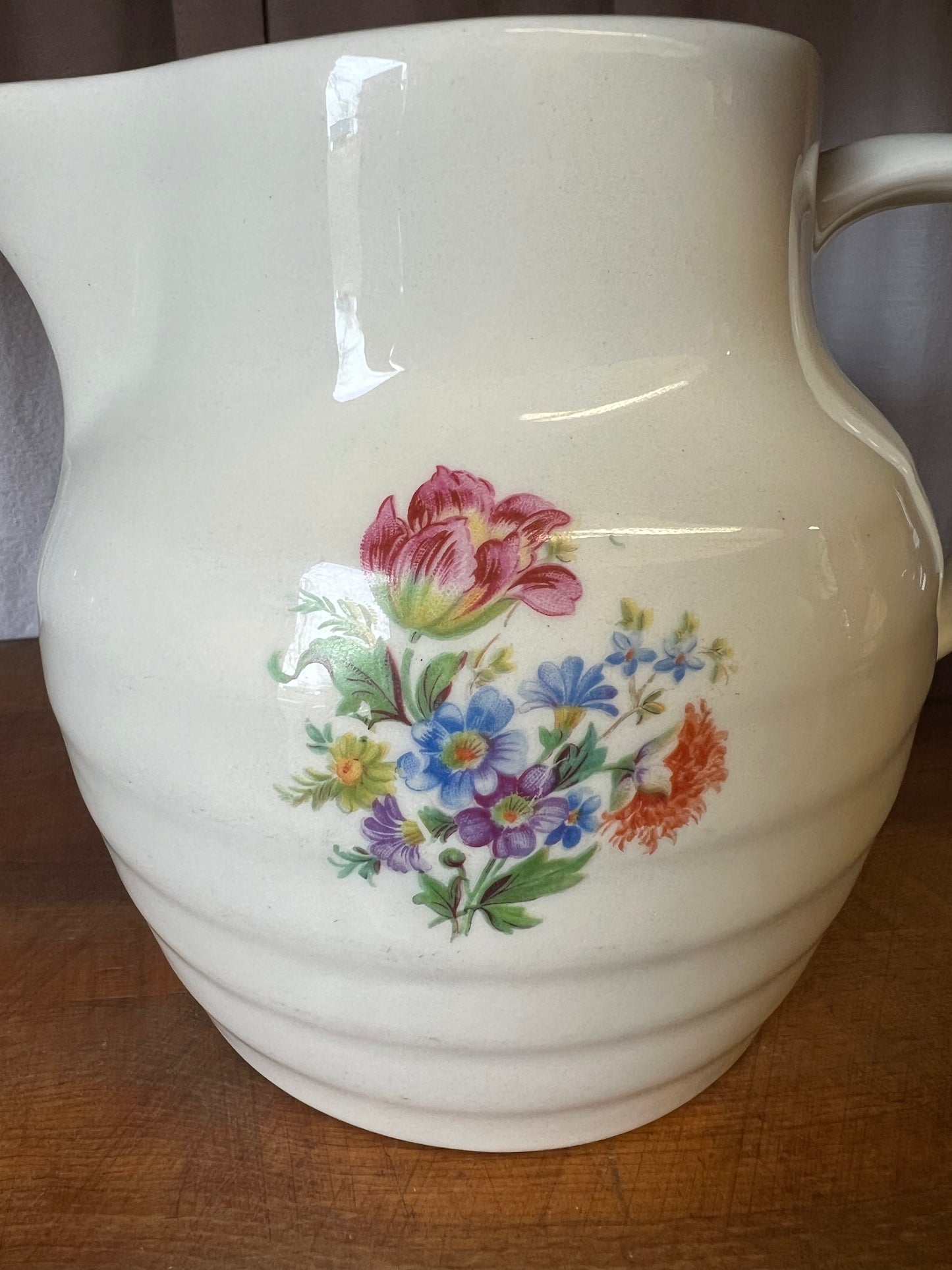 Kanna med blomster